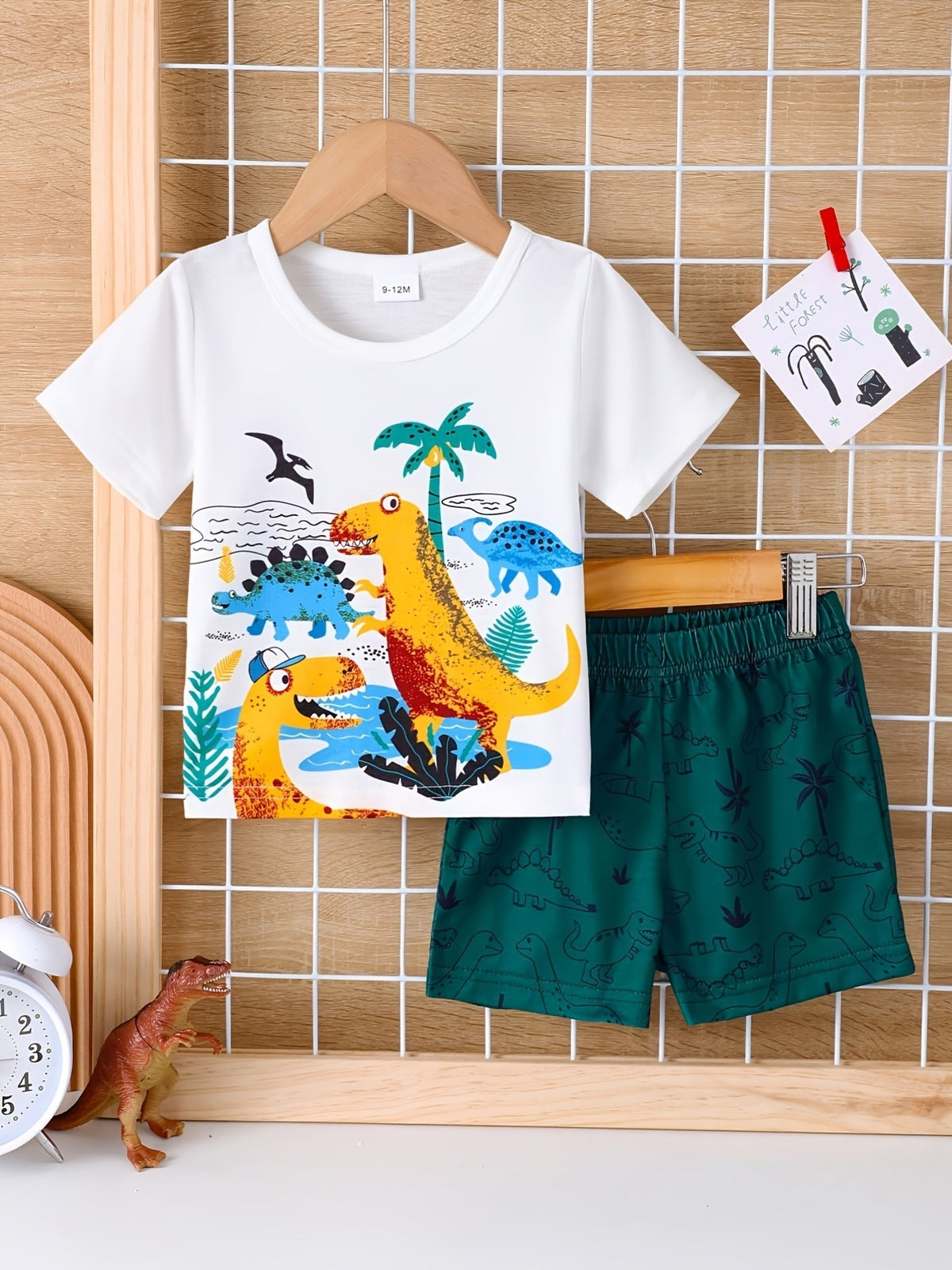 Baby dinosaur adventure set with white tee and green shorts.