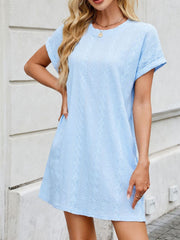 Light blue eyelet mini dress with diamond pattern and crew neck.