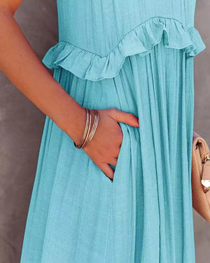 Light blue ruffled maxi dress with pockets, polyester fabric.