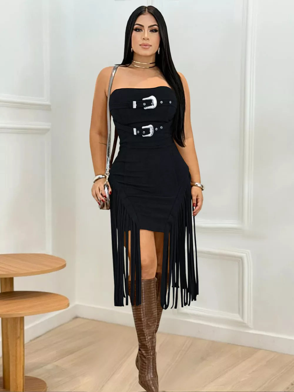 Black asymmetrical fringe dress with double buckle detail and strapless neckline.