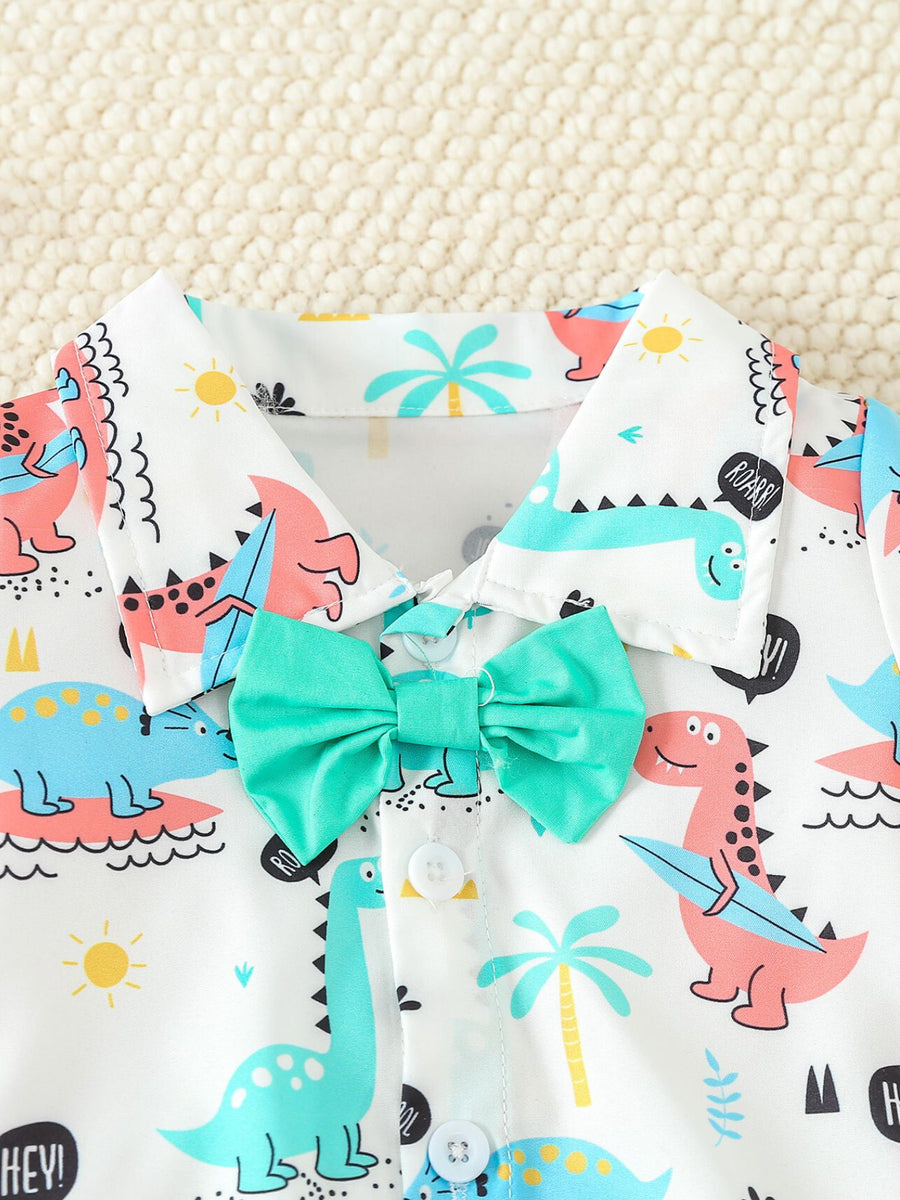 Baby bodysuit with dinosaur print, collared, short sleeves, and teal bow tie.