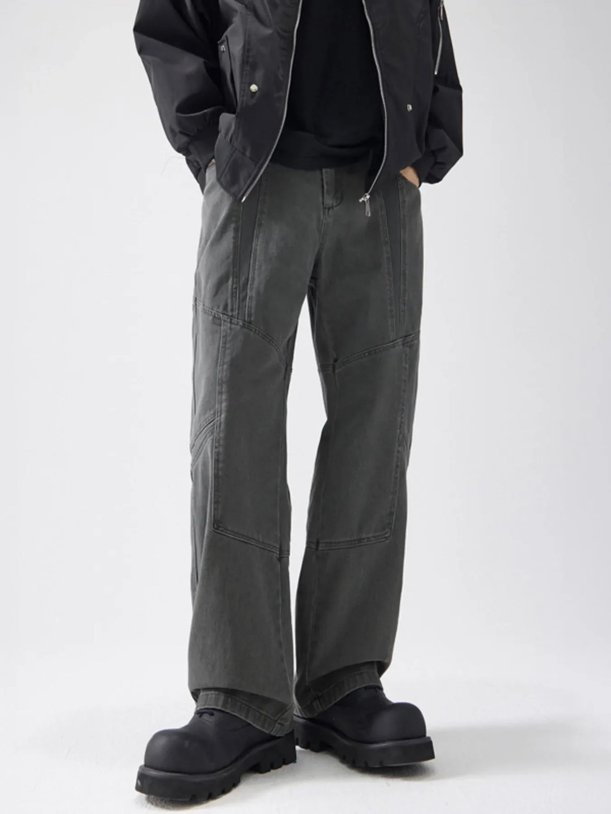 Gray wide-leg cotton trousers with panel detailing and a relaxed fit.