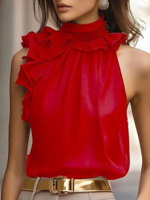 Red ruffled high neck sleeveless blouse with cascading ruffles.