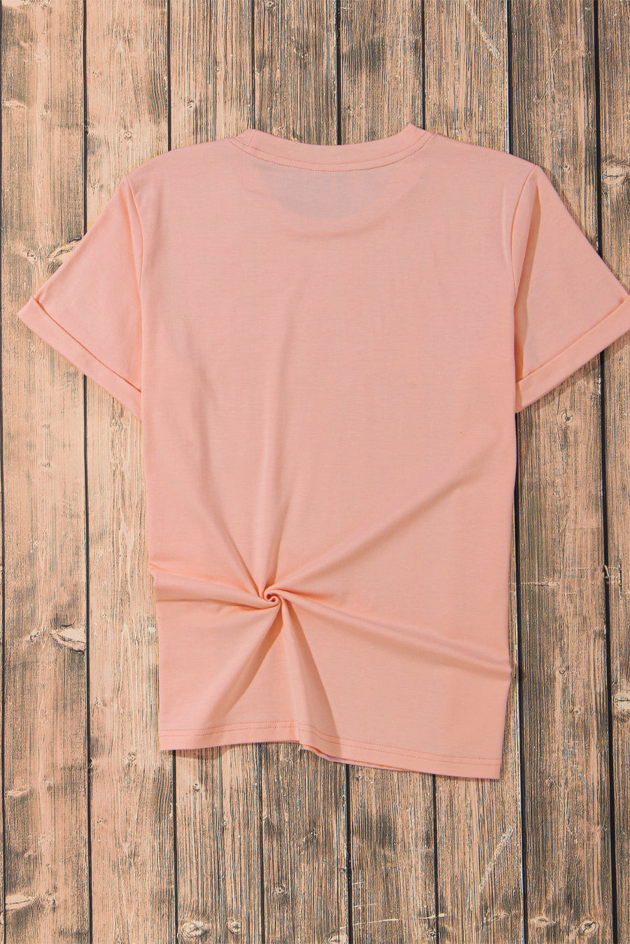 Watermelon pink t-shirt with rolled sleeves and a twisted hem detail.