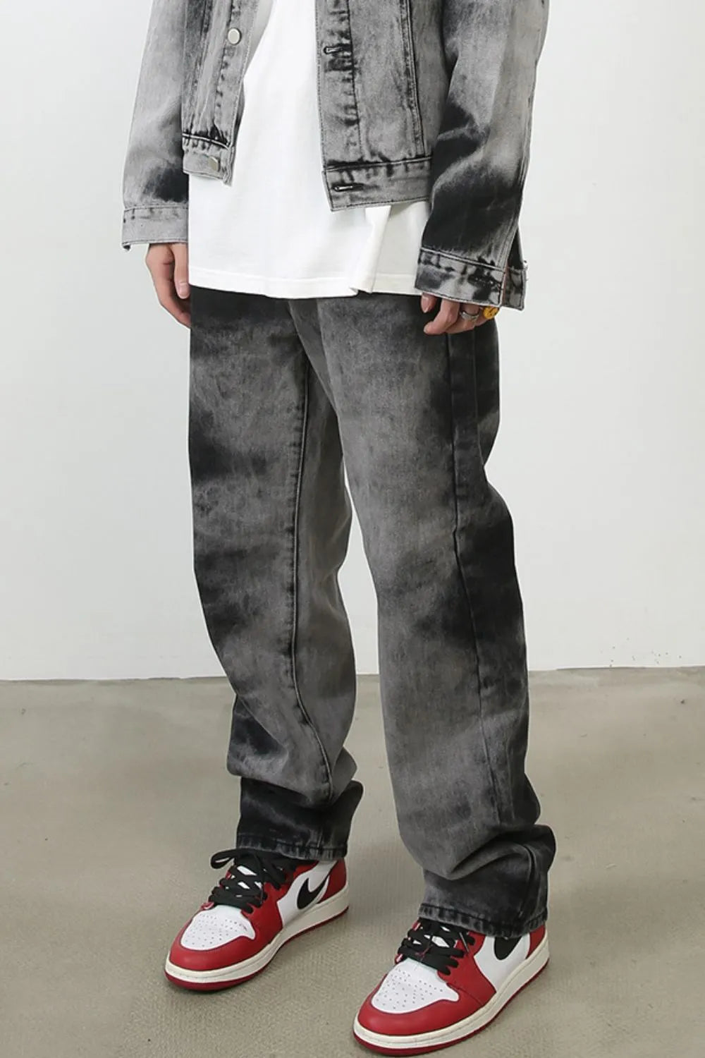 Charcoal wash denim jeans with a straight leg cut and a baggy fit.