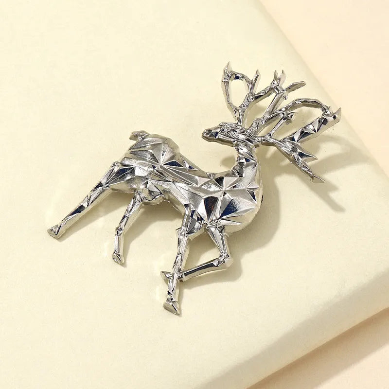 Silver geometric stag brooch made of alloy with faceted details.