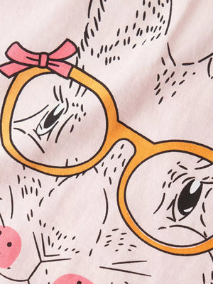 Pink graphic tee with cartoon bunny wearing glasses and a bow.