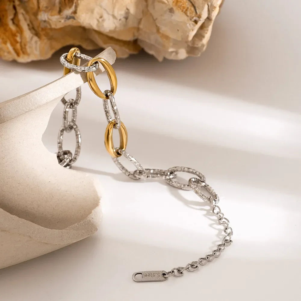 Two-tone link bracelet with gold and silver oval links, 18K gold-plated detail.