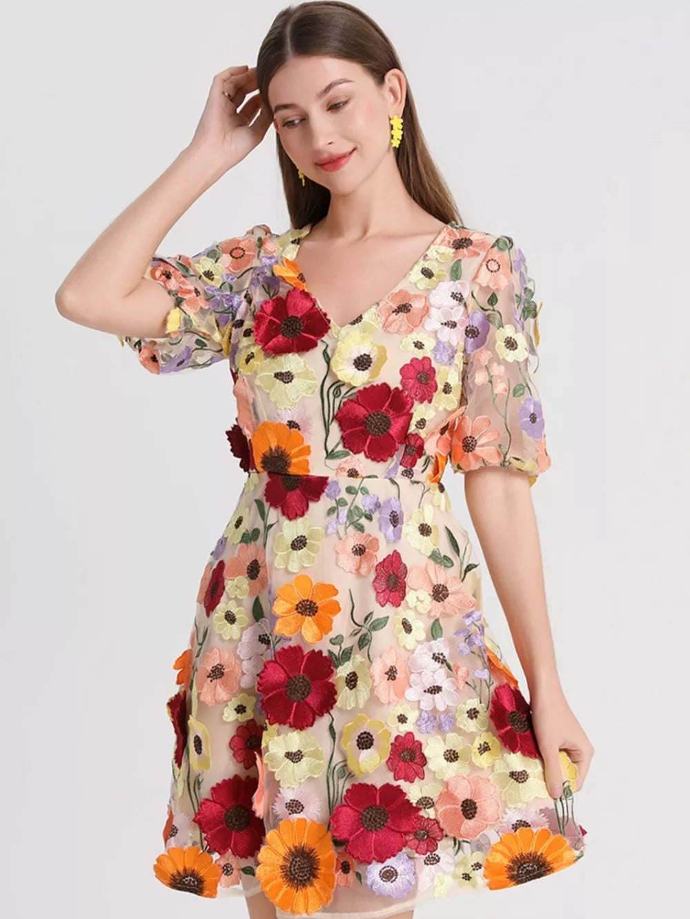 Sheer floral embroidered dress with V-neck and short sleeves in a multicolor floral pattern.