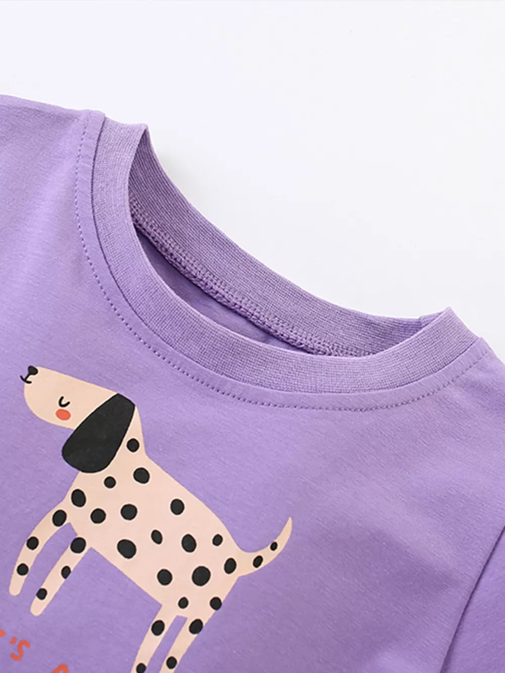 Purple cotton blend toddler dress with playful dalmatian dog graphic and round neckline.