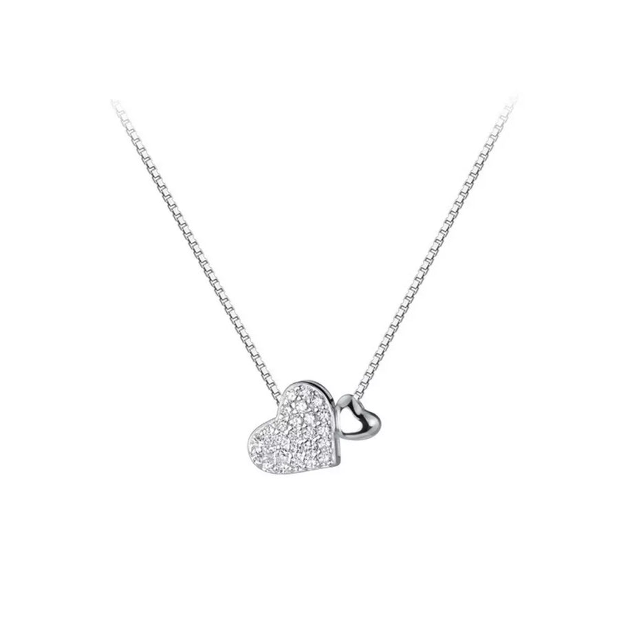 Elegant heart pendant necklace with pave zircon detail on a sterling silver box chain.