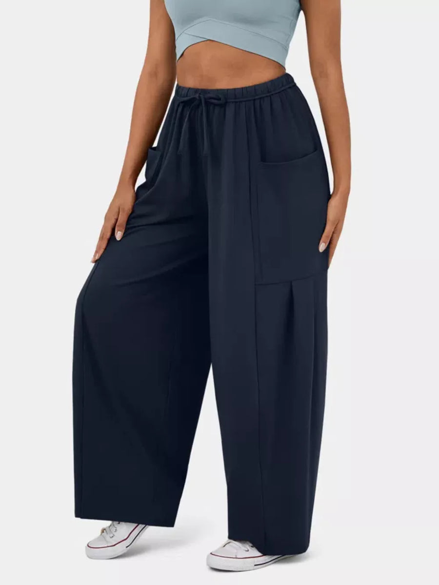 Dark Blue maternity pants with wide legs, drawstring waist, and pockets.