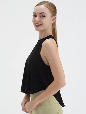 Black sleeveless flowy crop top with a high neckline.