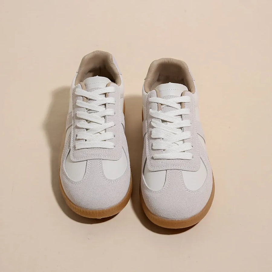 Beige suede and leather retro trainers with white laces and gum soles.