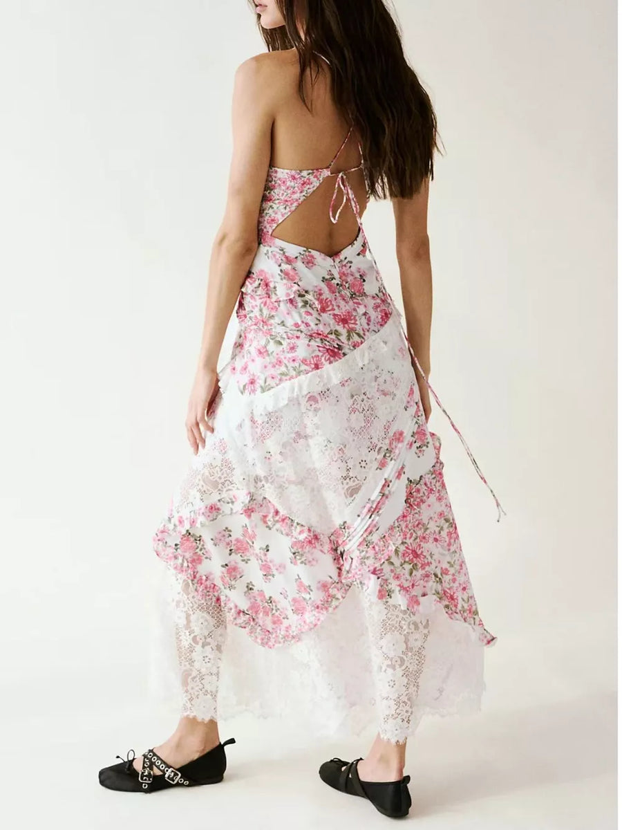 Floral lace maxi dress with ruffles and open back, featuring a pink floral print and white lace trim.