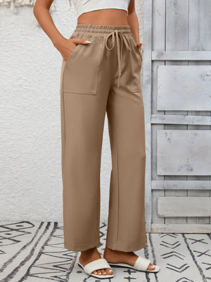 Khaki drawstring wide-leg pants with elastic waist and patch pockets.