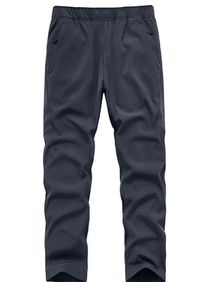 Plus size men's blue sweatpants with elastic waistband and zippered pockets.