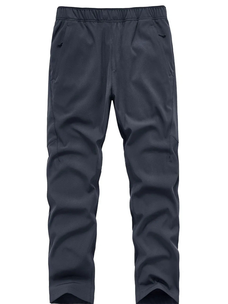 Plus size men's blue sweatpants with elastic waistband and zippered pockets.