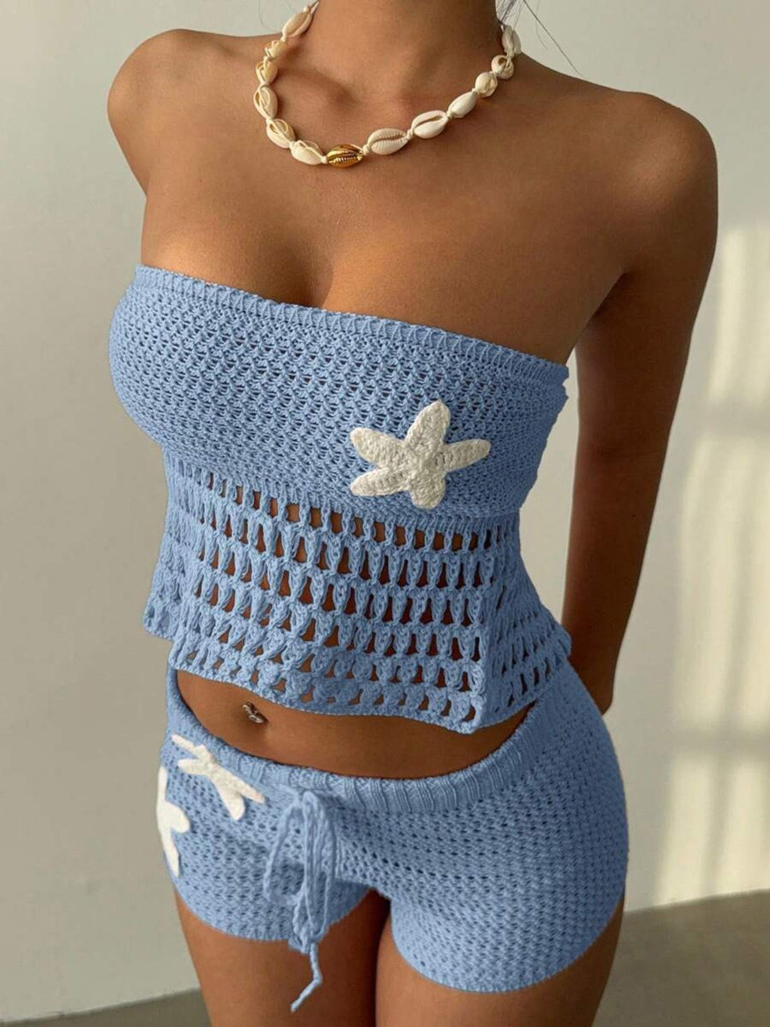Blue crochet tube top and shorts set with white starfish appliques and drawstring shorts.