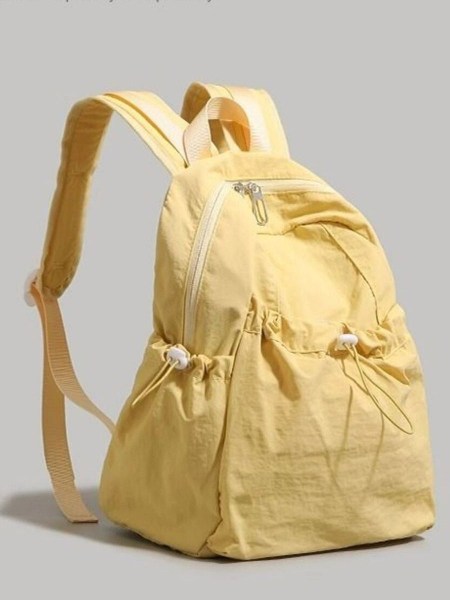 Yellow lightweight nylon backpack with adjustable straps and drawstring pockets.
