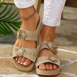 Beige floral appliqué mid-heel sandals with cut-out details and double strap design.