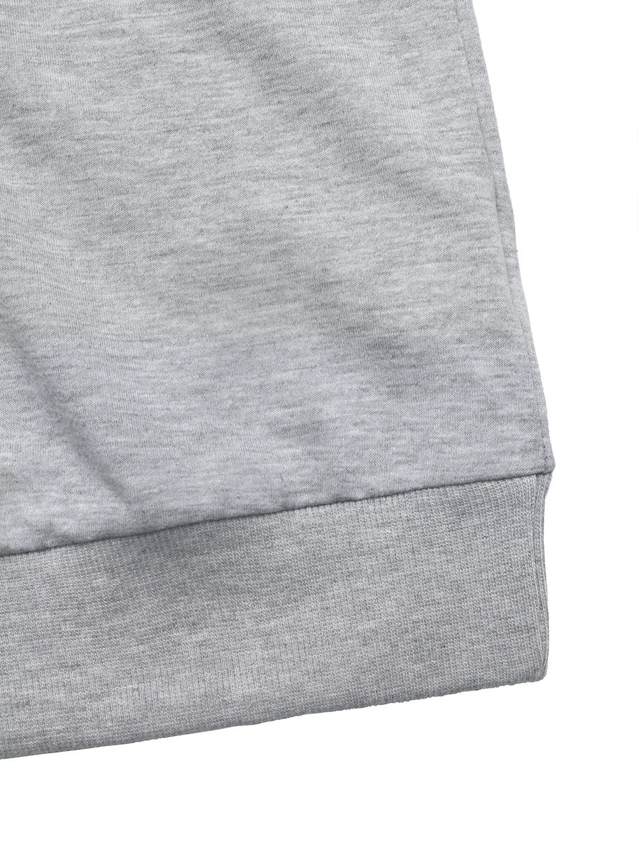 Gray sweater with ribbed hem detail.