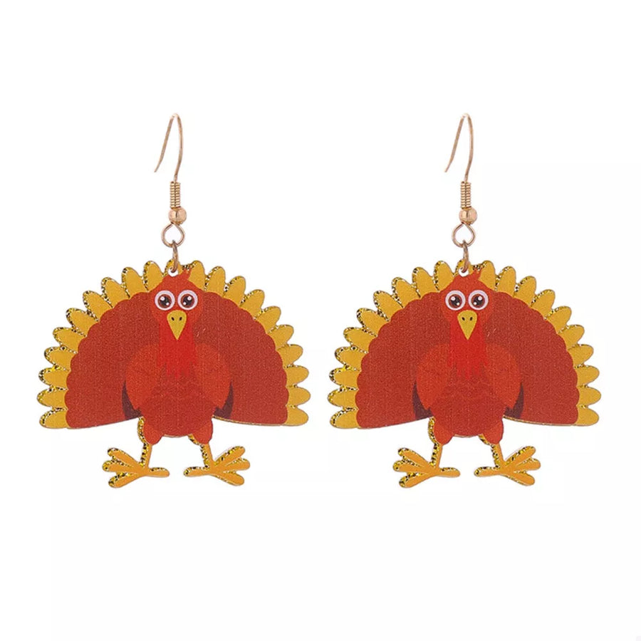 Festive turkey dangle earrings in acrylic with gold accents.