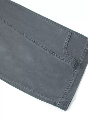 Grey cotton sweatpants with wide legs and visible stitching detail.