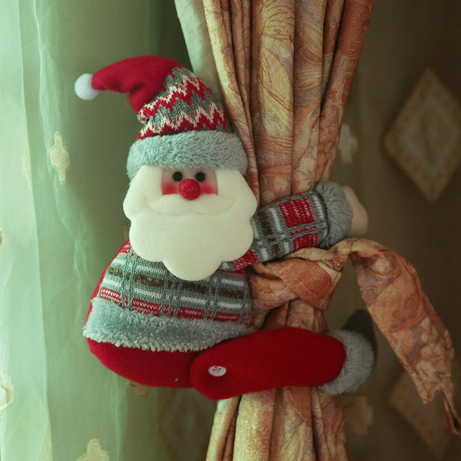 Festive Santa curtain tieback with red, grey, and white patterned sweater and hat.