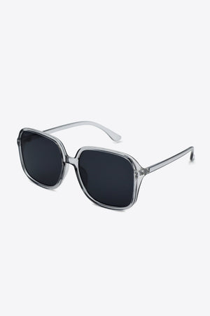 Retro square frame sunglasses with clear frames and dark lenses.