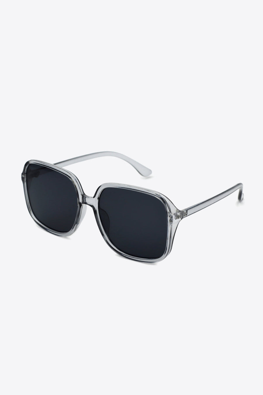 Retro square frame sunglasses with clear frames and dark lenses.