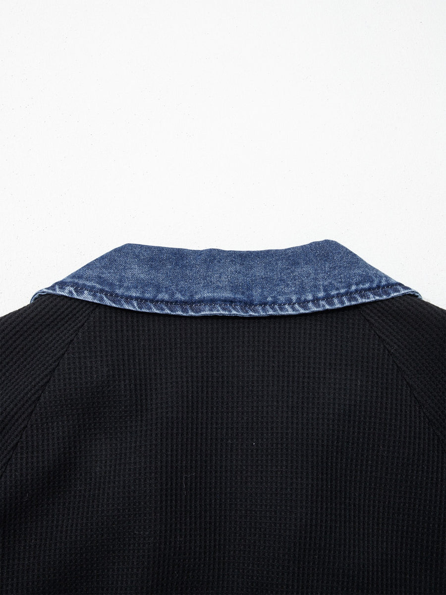 Black textured knit polo top with denim collar detail