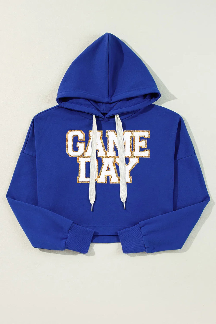 Royal blue cropped hoodie with glitter "GAME DAY" graphic and white drawstrings.
