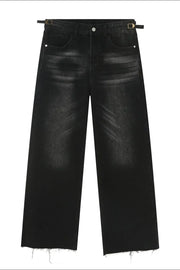Faded wash wide leg jeans in dark denim with adjustable buckle detail and raw hem.