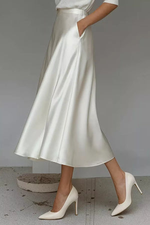 White satin midi skirt with a-line cut and hidden pockets