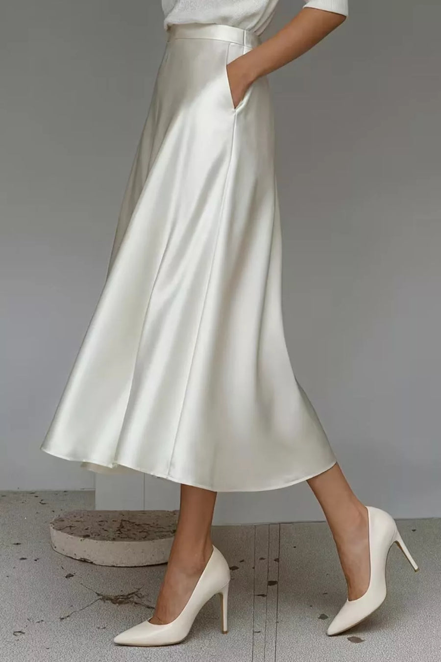 White satin midi skirt with a-line cut and hidden pockets