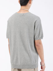 Men's gray knit t-shirt with short sleeves and a textured pattern.