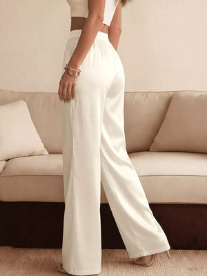 White wide-leg maternity pants with lace trim and a high waist.
