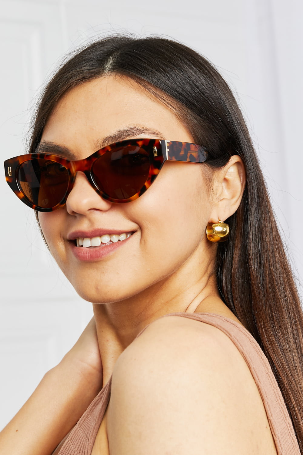 Cat-eye tortoise shell acetate sunglasses with gold accents