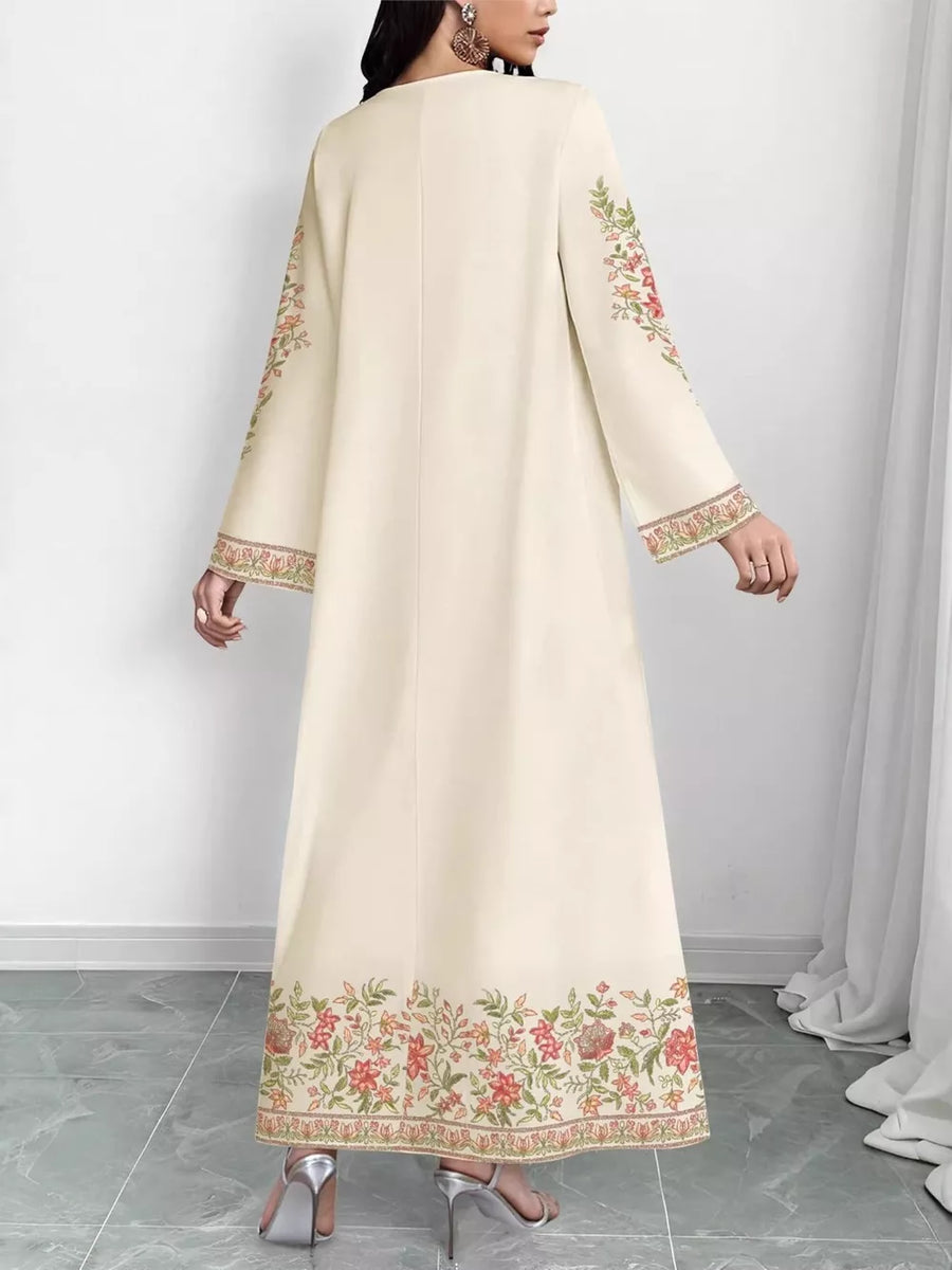 Elegant cream maxi dress with floral embroidery on sleeves and hem.