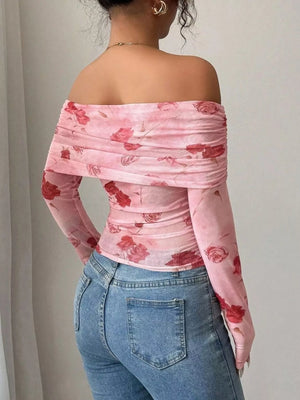 Pink floral mesh off-shoulder top with ruched detail and long sleeves.