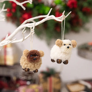 Woolly sheep ornaments with pom-pom ears and beaded feet, one white and one tan.