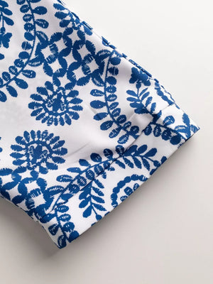 Blue and white printed romper sleeve detail