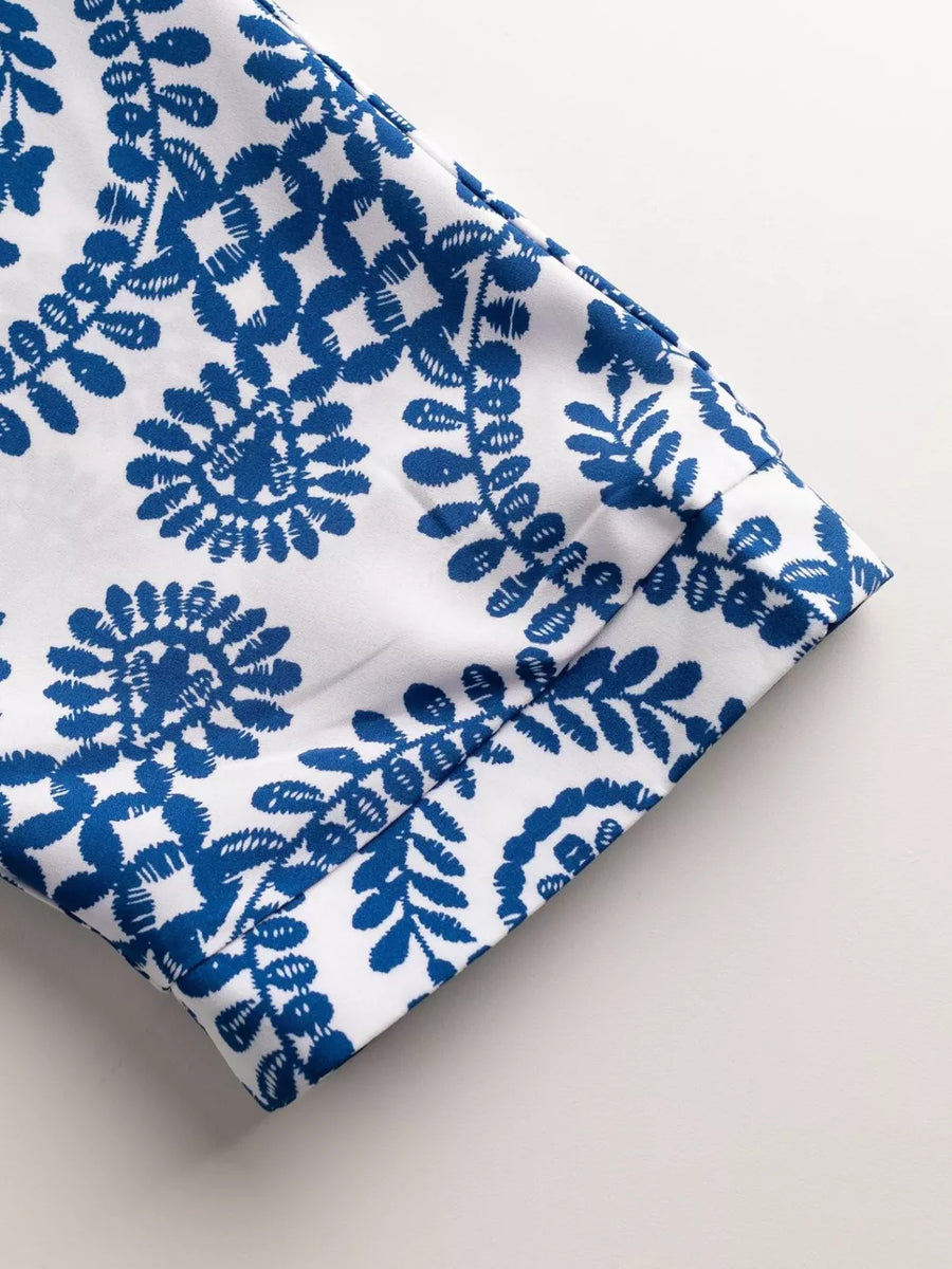 Blue and white printed romper sleeve detail