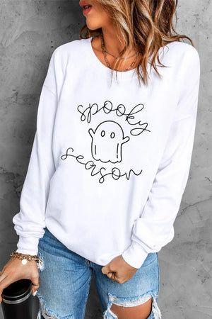 White crewneck sweatshirt with spooky season ghost graphic and script text.