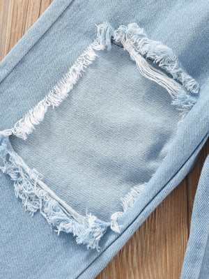 Light wash denim jeans with distressed patches and frayed hems for toddlers.