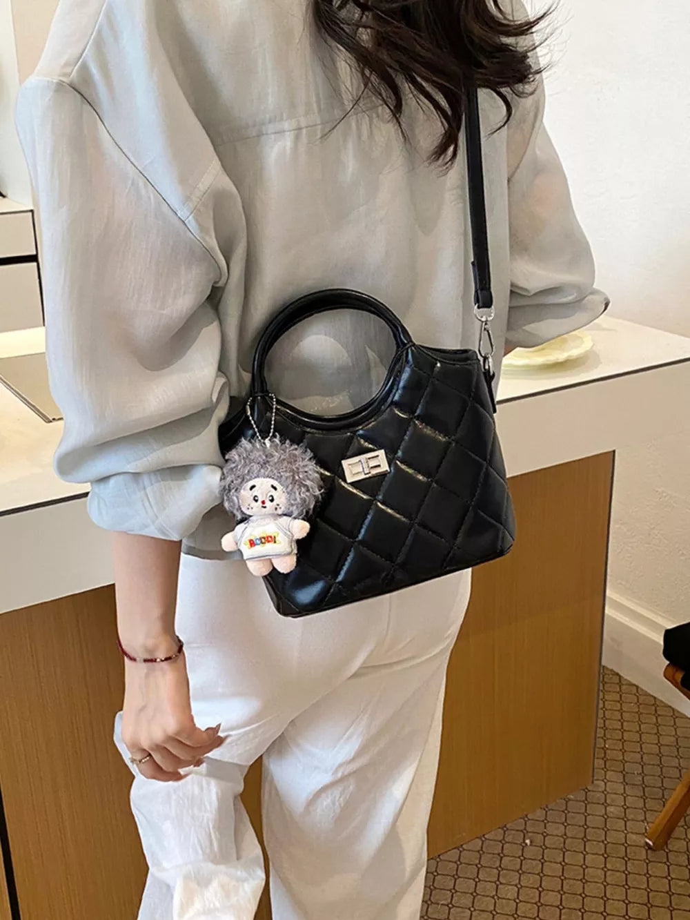 crossbody bag in black with quilted and small