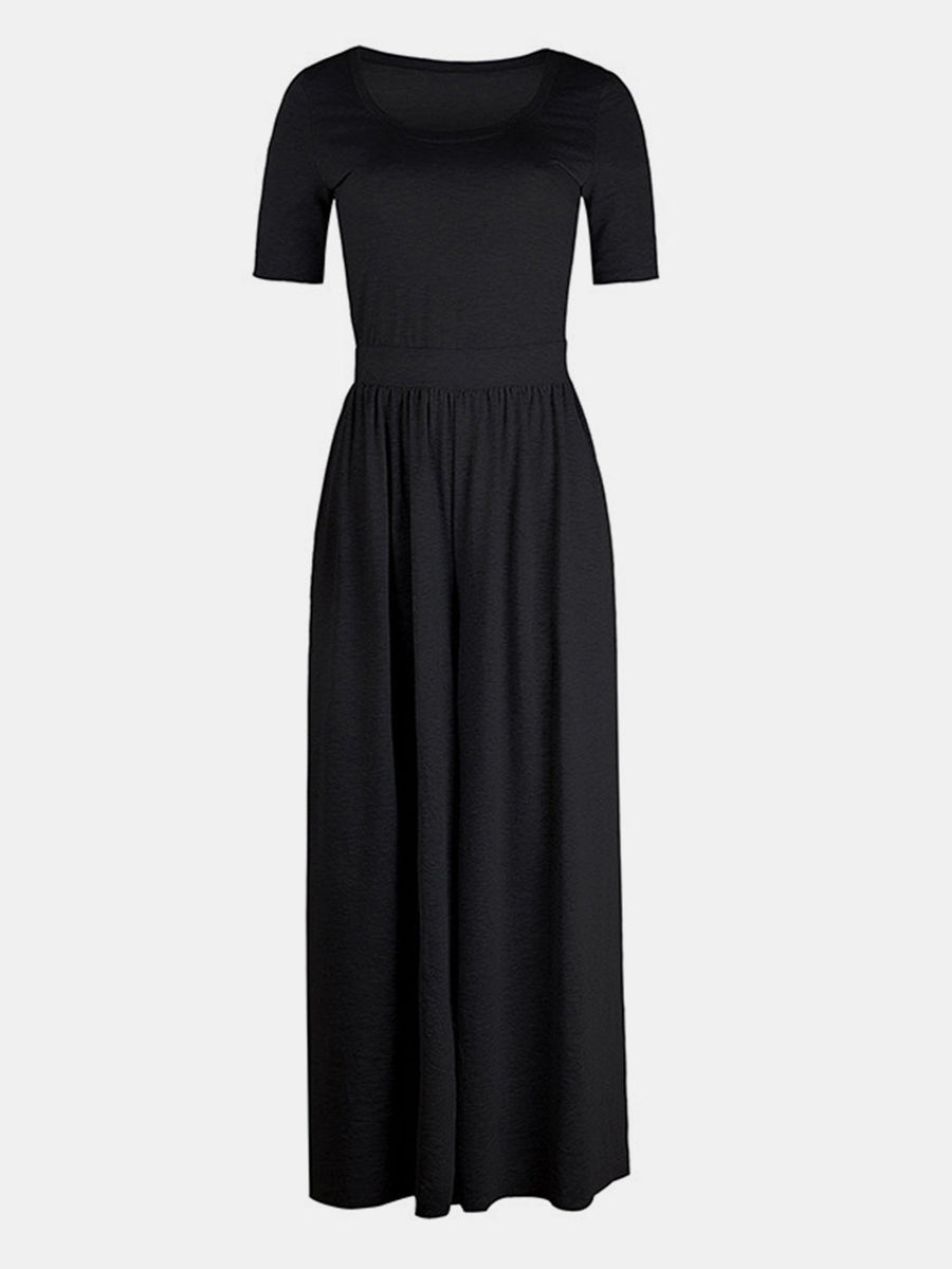 Black textured wide-leg jumpsuit with short sleeves and subtle elastic waist