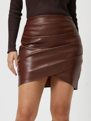 Brown faux leather wrap mini skirt with asymmetrical draped detail
