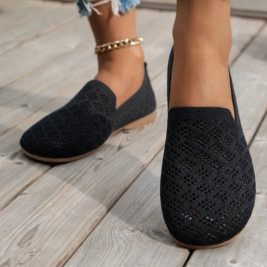 Black diamond knit loafers with a tan sole.